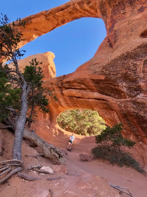 This is a photo of Haleigh leaning on the bottom of the "Double O" Arch. 