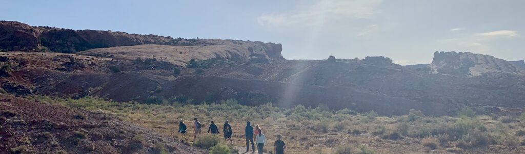 A view of hikers at the beginning of the trail.  