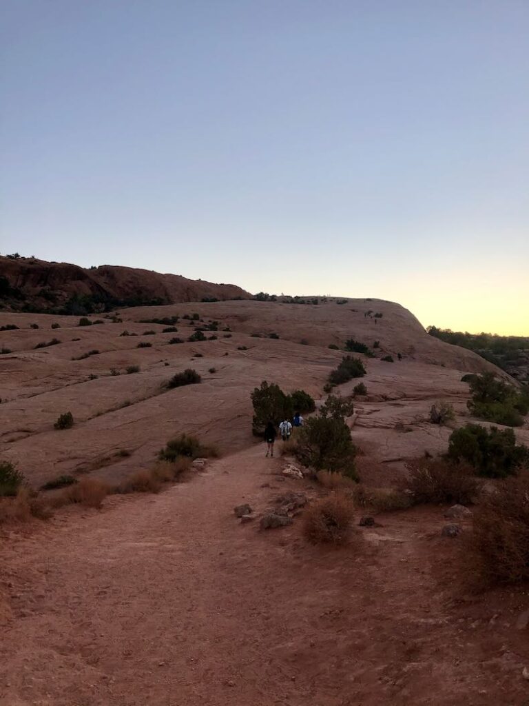 A view of hikers on the second section of the trail which is known as slick rock.    