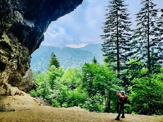 Haleigh taking a photo of Alum Bluff on the Mount Le Conte Trail