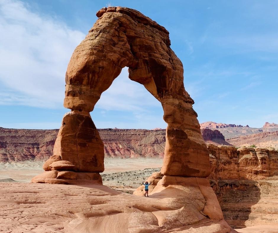 Lori Standing under Delicate Arch