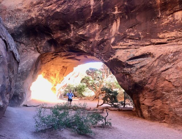 Haleigh is standing in front of the Navajo Arch. 