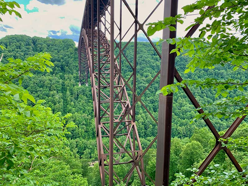 A side view of the underside of the New River Gorge Bridge.   