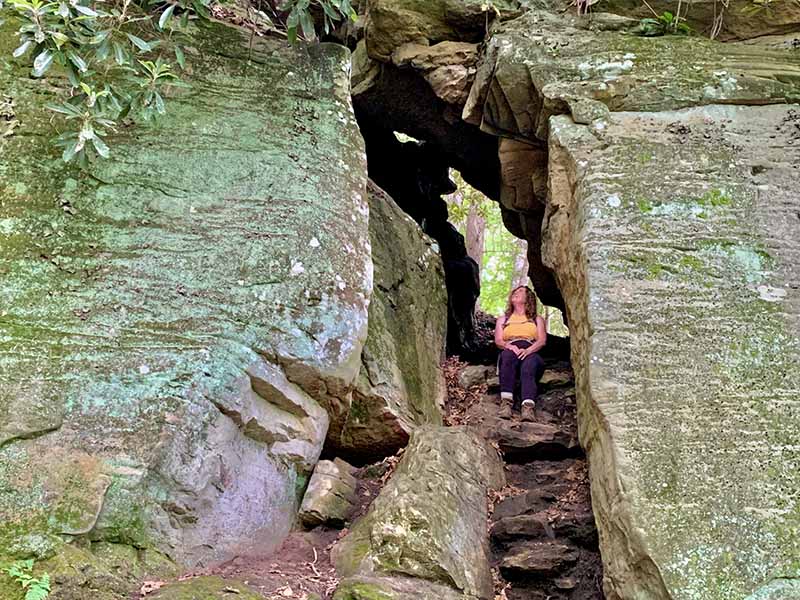 Lori taking a break in a cool tunnel located on the Tunnel Trail.   